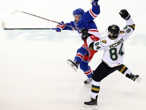 London Knights forward JJ Piccinich collides with Kitchener Rangers defenceman Miles Liberati during Game 4 of their OHL playoff series at the Kitchener Memorial Auditorium on April 14, 2016. (Free Press file photo)