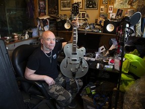 Bob Reid of the London band Bobnoxious will play Cindy Devine's silver Gretsch guitar at a benefit concert on Thursday at Eastside Bar and Grill. Funds raised at the concert will go toward a campaign called Cindy's Law to make fire extinguishers mandatory in vehicles. (Derek Ruttan/The London Free Press)