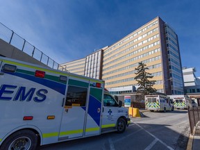 Ambulances sit outside the emergency entrance at Foothills Medical Centre in Calgary on Thursday, March 10, 2022.