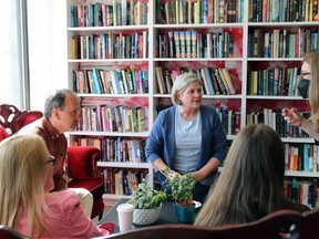 NDP Leader Andrea Horwath and Harvey Bischoff, the NDP candidate for Brantford-Brant, chat with elementary school teacher Inge MacLeod of Paris and her daughter Mya at Dog-Eared Cafe in Paris on Thursday where Horwath announced details of her party's universal mental health plan. Michelle Ruby