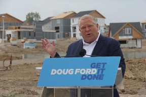 Premier Doug Ford talks during a campaign event in London Saturday at the site of a new development in the Glen Cairn neighbourhood. (JONATHAN JUHA/The London Free Press)