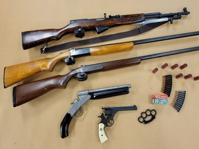 London police seized five firearms, ammunition and brass knuckles from a home on Sevilla Park Place. (London police photo)