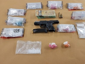 London police seized a loaded handgun, fentanyl and other drugs and cash after arresting two men Thursday. (London police photo)