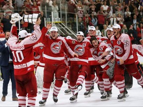The St. Catharines Falcons prepare to swarm captain Joe Colasurdo after winning the Sutherland Cup at Chatham Memorial Arena in Chatham, Ont., on Sunday, May 29, 2022. Mark Malone/Chatham Daily News/Postmedia Network
