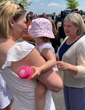 NDP leader Andrea Horwath spoke to Londoner Lynda Cairns-Desbiens during a campaign stop on Sunday. The London woman is caught between a tax rule and WSIB policy, an issue explored in a recent LFP article. (Randy Richmond/The London Free Press)