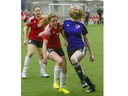 Claire Edwards of Alliance FC (right) and Nathalie Wedermann of the Oakridge Firebirds battle for the ball during their Elgin Middlesex District Indoor Soccer League 08/09G game at the BMO Centre in London. Oakridge won, 2-0. Derek Ruttan/The London Free Press