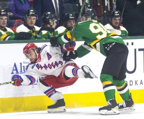 London Knights player Landon Sim checks out Kitchener Rangers rival Mike Petizian during their playoff match at Budweiser Gardens in London on Sunday May 1, 2022. Derek Ruttan/The London Free Press