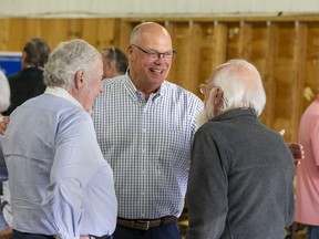 PC candidate Rob Flack taking in a campaign rally at the Dorchester fairgrounds. (Derek Ruttan/The London Free Press)