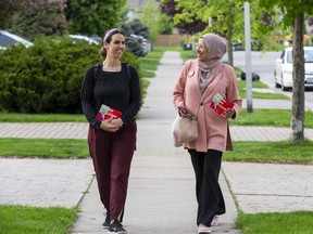 Liberal candidate Zeba Hashmi (right) and volunteer Zaheiya Moussa canvas the London-Fanshawe riding in London. (Derek Ruttan/The London Free Press)