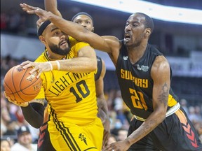 Cameron Forte of the London Lightning tries to work his way out of a double team from Dexter Williams Jr. and Kirk Williams Jr. of the Sudbury Five during a game Thursday, May 12, 2022, at Budweiser Gardens in London. The Lightning open a semifinal series against the Windsor Express on Sunday at Budweiser Gardens. (Mike Hensen/The London Free Press)