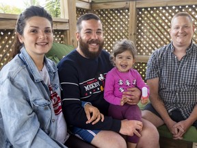 Ukrainian refugees Julia and Mohamad El Sakka with their daughter two-year-old Yamila, sit with Granton homeowner James Miller who with his wife opened up their home for Ukrainian refugees.  (Mike Hensen/The London Free Press)