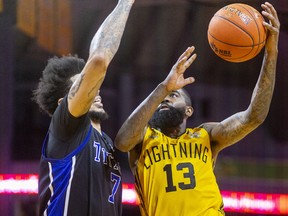 Terry Thomas of the London Lightning goes up for a shot against Tyran Walker of the KW Titans during Game One of the National Basketball League of Canada finals at Budweiser Gardens in London. Photograph taken on Friday May 27, 2022. Mike Hensen/The London Free Press