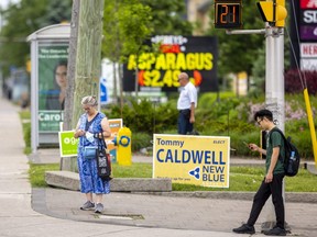 Relatively few signs are up for this provincial election with many sites, normally filled chock-a-block with signs, this year having few if any. The intersection of Wonderland Road and Oxford Street is one that has signs from most parties. Photograph taken on Wednesday June 1, 2022. (Mike Hensen/The London Free Press)