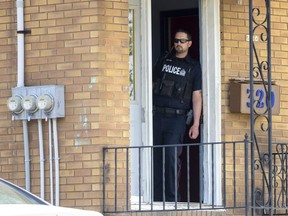 Police guard the scene where shots were fired at 320 Hilton Ave. in London.  Photograph taken on Wednesday May 11, 2022. 
(Mike Hensen/The London Free Press)