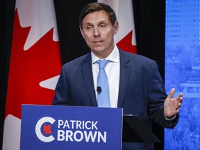 Patrick Brown gestures at the Conservative Party of Canada English leadership debate in Edmonton, Alta., Wednesday, May 11, 2022.&ampnbsp;The Conservative Party of Canada says the member who sent Brown's leadership campaign a racist email has resigned their membership.&ampnbsp;THE CANADIAN PRESS/Jeff McIntosh