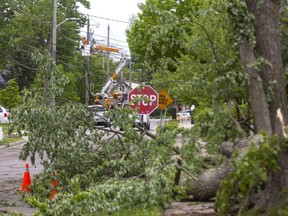 Two Tornadoes Hit London In Wild Storm: Western University Researchers London Hydro Crews Were Still Working Sunday Morning To Clean Up The Damage Caused By A Storm That Crashed Through London Saturday Afternoon. Photograph Taken On Sunday May 22, 2022. (Mike Hensen/The London Free Press)