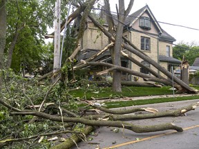 This house at Waterloo and Hyman streets near downtown London suffered serious damage when two trees came apart during Saturday's storm. Photograph taken on Sunday May 22, 2022. Mike Hensen/The London Free Press