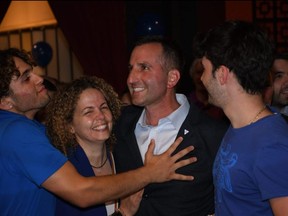 Trevor Jones celebrates with his son Alex, left, wife Najet, and son Nico after being elected Progressive Conservative MPP for Chatham-Kent-Leamington on Thursday June 2, 2022. (TOM MORRISON/Postmedia Network)