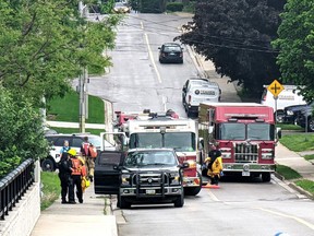 A section of St. Vincent Street in Stratford was closed for a few hours Wednesday afternoon as police negotiated with a man carrying a sheathed sword who had jumped into the Avon River nearby. (Galen Simmons/The Beacon Herald)