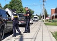 Lambton OPP officers are stationed out front of Lambton Central secondary school in Petrolia on Thursday after threatening graffiti was found.(Terry Bridge/Postmedia Network)