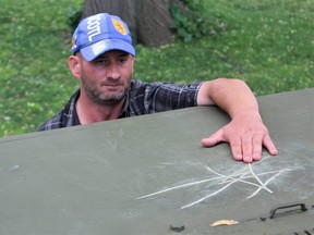 London resident Grant MacDonald, who visits the Holy Roller daily, said he's angry that someone vandalized the Second World War monument. (DALE CARRUTHERS/The London Free Press)