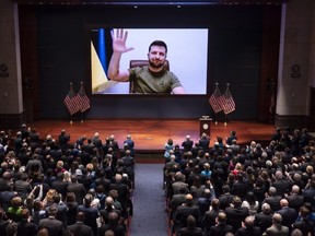 Ukrainian President Volodymyr Zelenskyy speaks to the U.S. Congress by video on March 16 to plead for support as his country is besieged by Russian forces. For the U.S. audience, Zelenskyy compared the invasion to Pearl Harbor and 9/11. (J. Scott Applewhite/Getty Images pool)