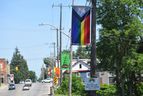 A Progress Pride banner hangs outside a Home Hardware on Stover Street last June, in Norwich, a rural community east of London.  The banner is one of two that were reinstalled after several were stolen in May 2022. (Calvi Leon/The London Free Press)
