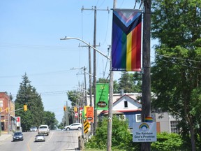 A Progress Pride banner hangs outside a Home Hardware on Stover Street in Norwich, a rural community east of London. A small sign mounted to the pole includes a Bible reference that reads: "The Rainbow God’s Promise. Genesis 9 v 16." The banner is one of two that were reinstalled after several were stolen last month. Calvi Leon/The London Free Press