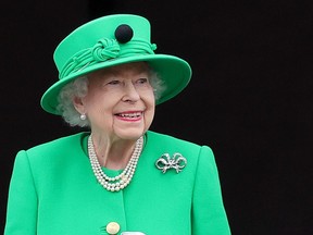 Queen Elizabeth II waves from the balcony of Buckingham Palace during the Platinum Jubilee Pageant on June 05, 2022 (Photo by Chris Jackson/Getty Images)