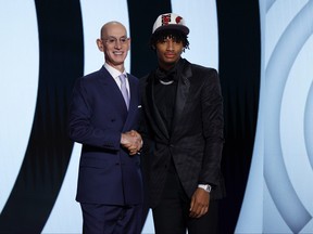 NBA commissioner Adam Silver (L) and Londoner Shaedon Sharpe pose for photos after Sharpe was drafted seventh overall by the Portland Trail Blazers during the 2022 NBA Draft at Barclays Center on June 23, 2022 in New York City. (Photo by Sarah Stier/Getty Images)