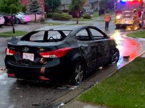 Denzel Borden, 30, faces multiple charges after a vehicle was damaged and set ablaze, shown here, before the garage of a home on Coronation Drive in northwest London was also set on fire on Tuesday June 7, 2022. Submitted photo