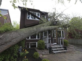 Aftermath of Saturday's storm damage in the Ajax, Ont., area shows massive damage to properties and knocked the power out, Sunday May 22, 2022.