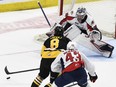 Windsor Spitfires goalie Matt Onuska stops Hamilton Bulldogs defenceman Arber Xhekaj on this drive to the net in the first period of Wednesday's Game 7 of the OHL final. Hamilton won, 6-1. Photo taken on Wednesday June 15, 2022.