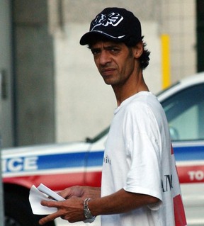 Eugene Francois, who was charged with mischief over the sale of videos showing “upskirt” views of young Toronto women, leaves a police station in Toronto in August 2002. (Toronto Sun file photo)