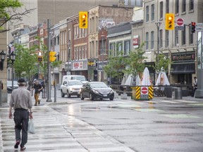 A traffic-signal pilot project aims to boost pedestrian safety by giving them a five-second headstart to cross the road at Dundas and Wellington streets before the light turns green for vehicles, a city official says. (Derek Ruttan/The London Free Press)