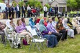 People listen to guest speakers at a ceremony to dedicate a new community garden at Maple Grove Park in northwest London to the Afzaal family on Monday June 6, 2022. (Derek Ruttan/The London Free Press)