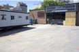 London's supervised drug-use site was expected to move from the trailer at left to its permanent building, right, at 446 York St. in mid-January 2023 once renovations are complete.  (Derek Ruttan/The London Free Press)