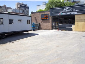 London's supervised drug-use site was expected to move from the trailer at left to its permanent building, right, at 446 York St. in mid-January 2023 once renovations are complete.  (Derek Ruttan/The London Free Press)