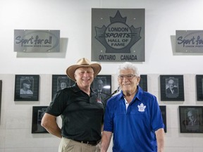 The London Sports Hall of Fame class of 2022 was announced at Budweiser Gardens in London on Monday. The class is comprised of David-Lee Tracey, left, the Western University cheerleading coach since 1981, Jim Agathos, right, longtime financial supporter and organizer of minor sports, Jessica Zelinka, record-setting heptathlon athlete, and Steve Rucchin, a former NHL hockey player.  (Derek Ruttan/The London Free Press)