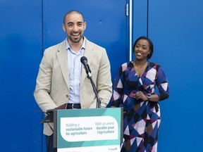 London West MP Arielle Kayabaga, right, listens to Aspire Food Group co-founder and chief executive Mohammad Ashour during a news conference to  announce federal investments in innovative agri-food technology in London on Monday, June 27, 2022. (Derek Ruttan/The London Free Press)