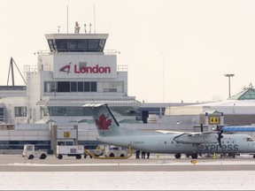 London airport terminal and tower with an Air Canada Express commuter aircraft.  Mike Hensen/The London Free Press file photo