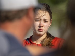 Mariia Romanova, 17, listens to the head coach of the Woodstock-based D1 Nationals U-19 team before a recent exhibition game in Belmont. (Mike Hensen/The London Free Press)