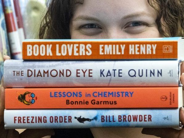 Alex Hawkins, fiction librarian at London Public Library's Central branch, is keeping a close eye on the hottest summer reads in London. Photograph taken on Wednesday June 22, 2022. 
Mike Hensen/The London Free Press