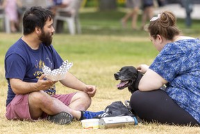David Lan eats chips with Ashley Bossence as Lewis longingly watches the London International Food & Drink Festival in Victoria Park.
