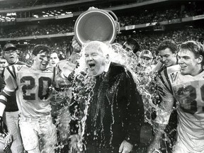Queen's Golden Gaels football coach Doug Hargreaves gets doused with water in the last few seconds of Queen's 31-0 victory over the St. Mary's Huskies in the Vanier Cup at the Sky Dome in Toronto on Saturday November 21, 1992. (Ian MacAlpine/Postmedia Network)