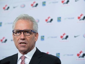 Hockey Canada president and chief executive Tom Renney speaks at a news conference in Vancouver, B.C. on Dec. 1, 2016. Hockey Canada executives were under fire Monday as parliamentarians grilled the national sport organization over its handling of an alleged sexual assault four years ago that resulted in a settled lawsuit last month.