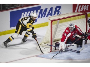 Hamilton Bulldogs player Mark Duarte attempts to get the puck past Windsor Spitfires goalie Matt Onuska during Game 4 of the OHL Final between the Windsor Spitfires and the Hamilton Bulldogs at the WFCU Center in Windsor on Friday June 10, 2022. Hamilton won 3-2 in overtime. Dax Melmer/Windsor Star