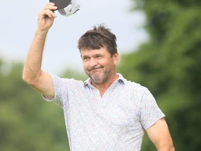 John Crowther of London doffs his cap to the spectators after finishing his final round in the Ontario senior men's golf championship at the Sarnia Golf & Curling Club in Sarnia on Wednesday, July 27, 2022. (Mark Malone/Postmedia Network)