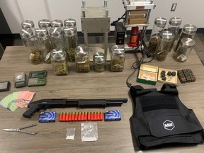St. Thomas police seize a shotgun, ammunition and drugs in a search of an apartment on Talbot Street on Friday, July 29, 2022.  (Police handout photo)
