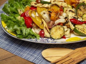 Grilled halloumi cheese, peppers and zucchini served with a light vinaigrette, lettuce and fresh bread make a tasty summer main dish, Jill Wilcox says. (Derek Ruttan/The London Free Press)